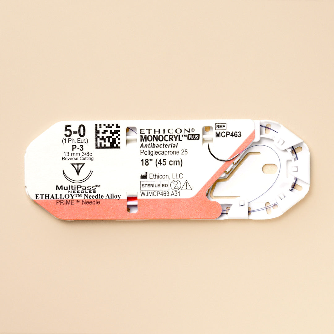 Box of Ethicon 5-0 MONOCRYL® Plus Violet Sutures, MCP463G, featuring antibacterial properties with an 18-inch length and a silver P-3 reverse cutting needle. The suture's unique composition and color are designed for effective wound closure with added infection control.