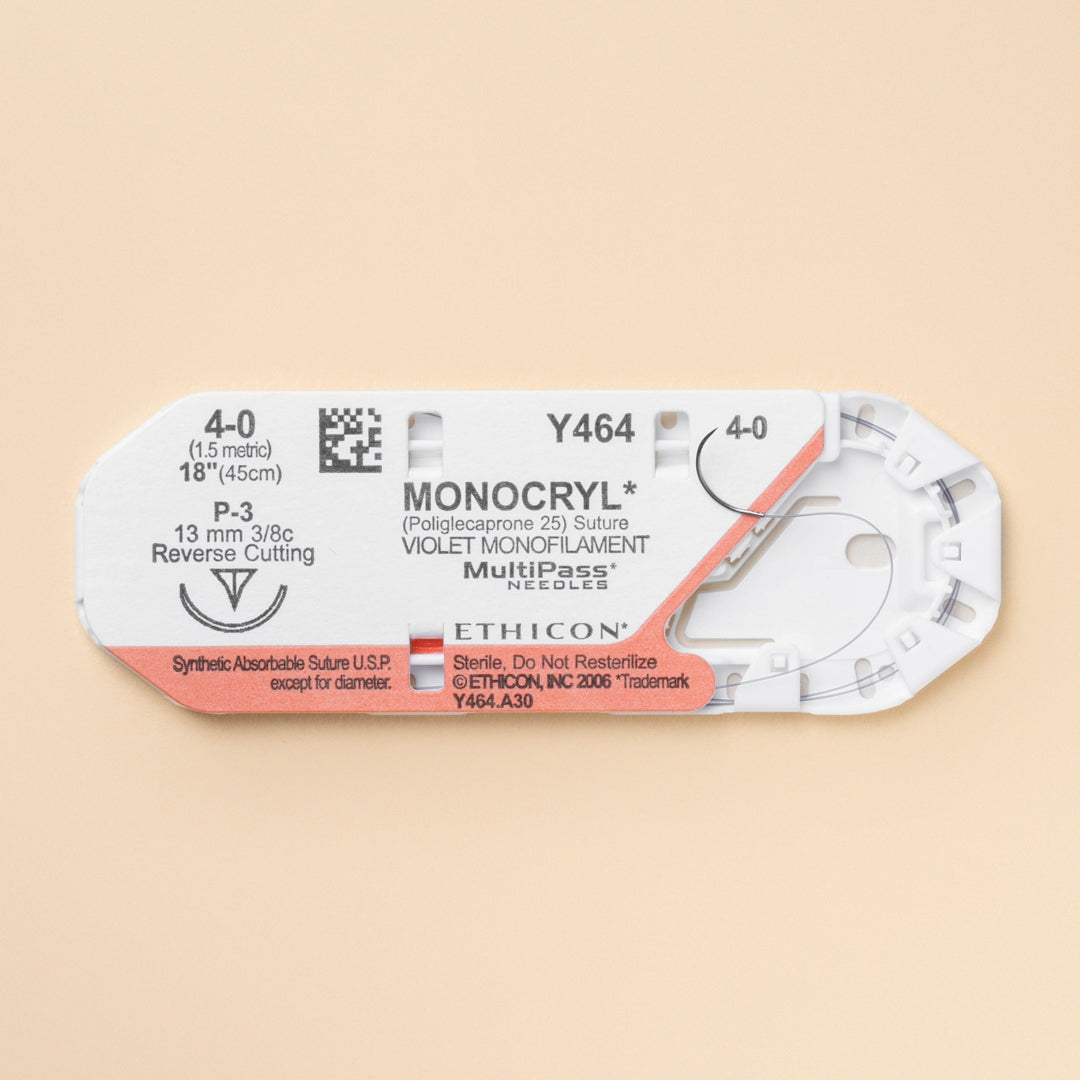 Box of Ethicon 4-0 MONOCRYL® Violet Sutures, model number Y464G, showcasing the sutures' distinctive violet color and equipped with a 13mm P-3 reverse cutting needle. The packaging highlights the sutures' absorbable nature, designed for effective and precise wound closure in surgical procedures