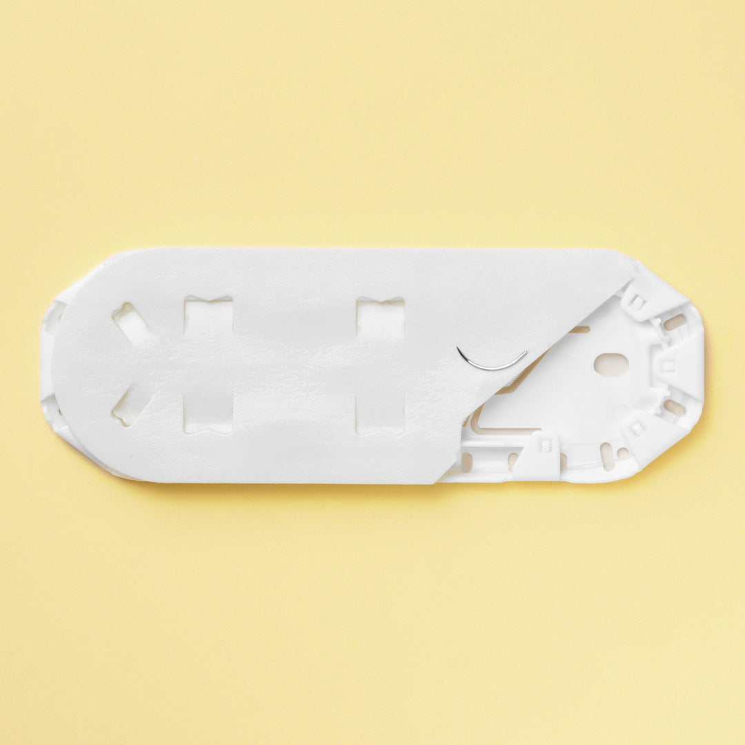 Box of 6-0 Plain Gut sutures, reference 1657G, showcasing the delicate, natural sutures equipped with a small 11mm P-1 reverse cutting needle for microsurgical precision. The bright yellow packaging indicates the specialized use of these sutures in procedures that require quick healing and minimal tissue disturbance