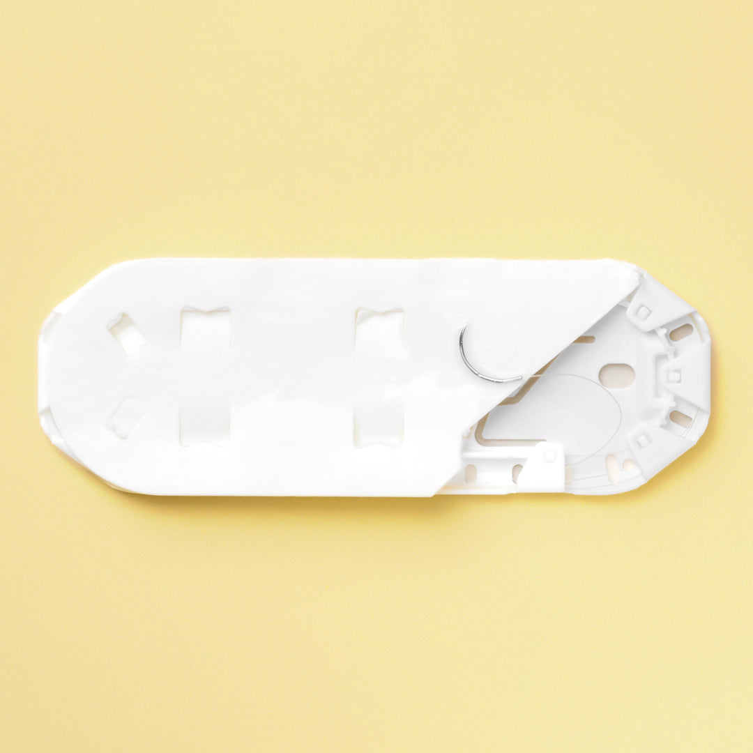 Box of 5-0 Surgical Gut Suture - Plain, model 686G, featuring yellowish tan sutures paired with a 13mm P-3 reverse cutting needle. The packaging emphasizes the suture's natural, absorbable qualities, tailored for precise and gentle tissue approximation in diverse surgical applications.