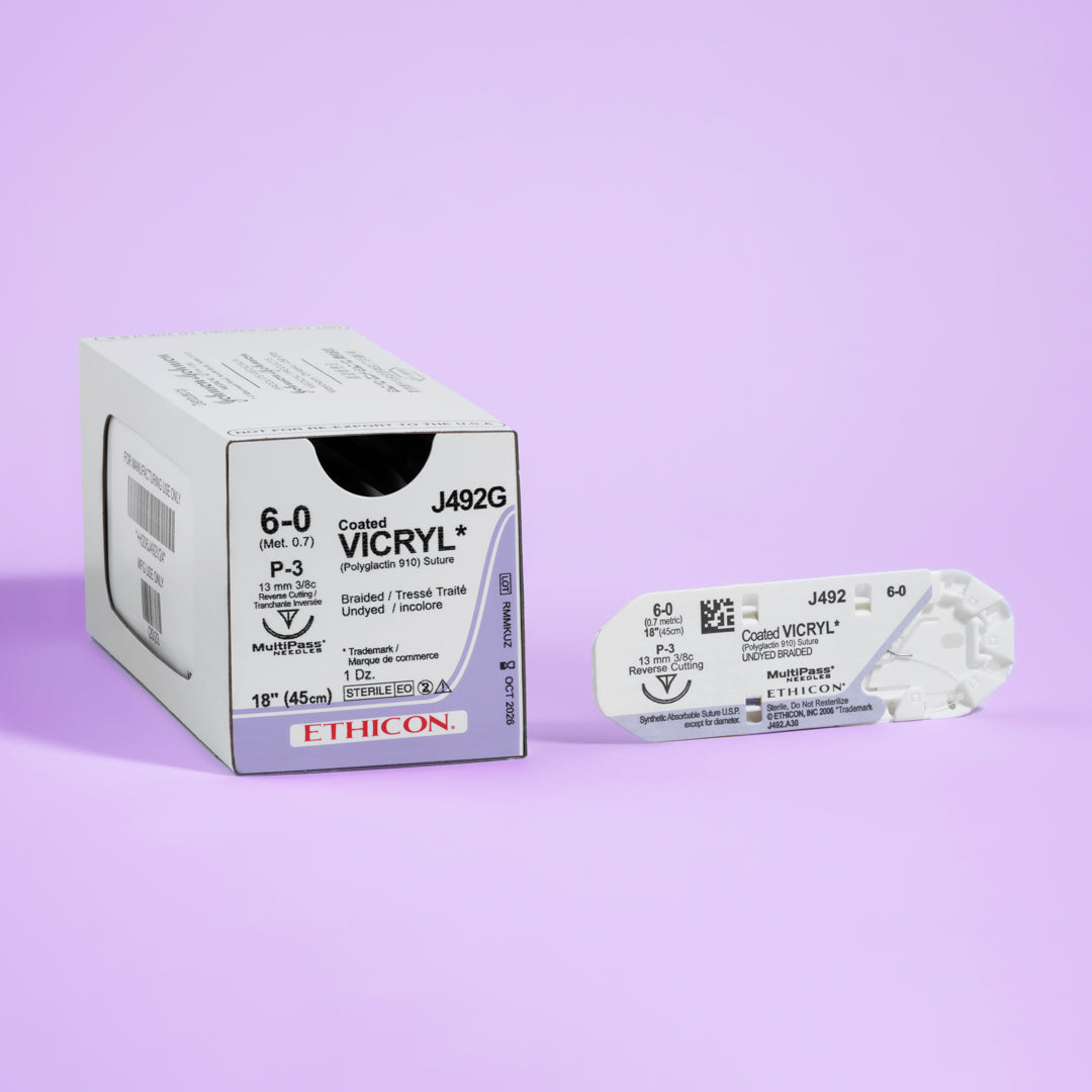 Box of COATED VICRYL® 6-0 Undyed Sutures, model J492G, showcasing fine sutures with a 13mm P-3 prime reverse cutting needle, optimized for precision in delicate surgical procedures. The packaging emphasizes the suture's absorbable qualities and its role in promoting seamless healing and patient comfort.