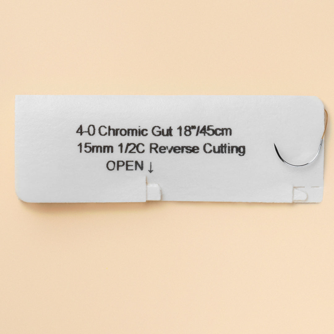 Box of 4-0 Chromic Gut sutures, model 544B, with 12 individually packaged sutures featuring a C-26 needle for precise suturing, providing extended support and consistent absorption for effective wound management.