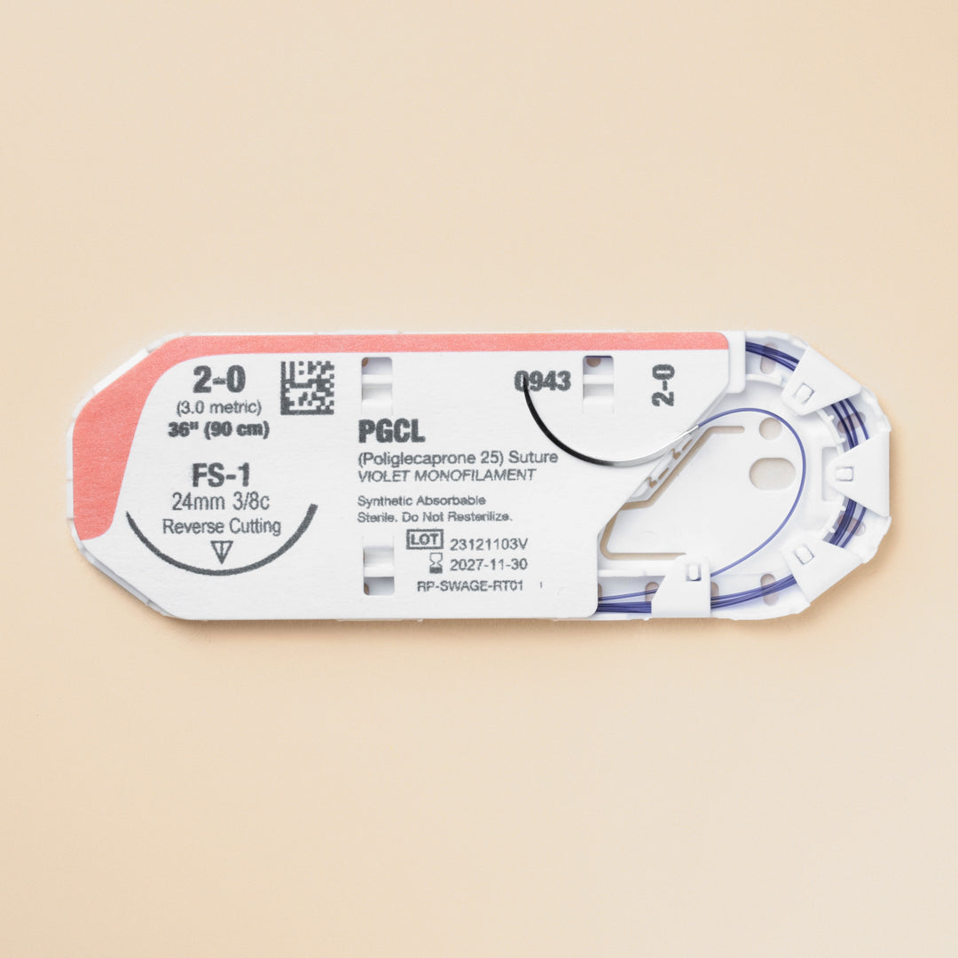 A display featuring a box and an individual pack of 2-0 MONOPRO Violet 36" FS-1 Needle sutures. The box is marked with the product reference PM943 and details the suture's specifications, such as size, length, and needle type. The packaging underlines its absorbable nature and suitability for veterinary use, highlighting MONOPRO's role in delivering high-quality suture materials for surgical precision and patient care.