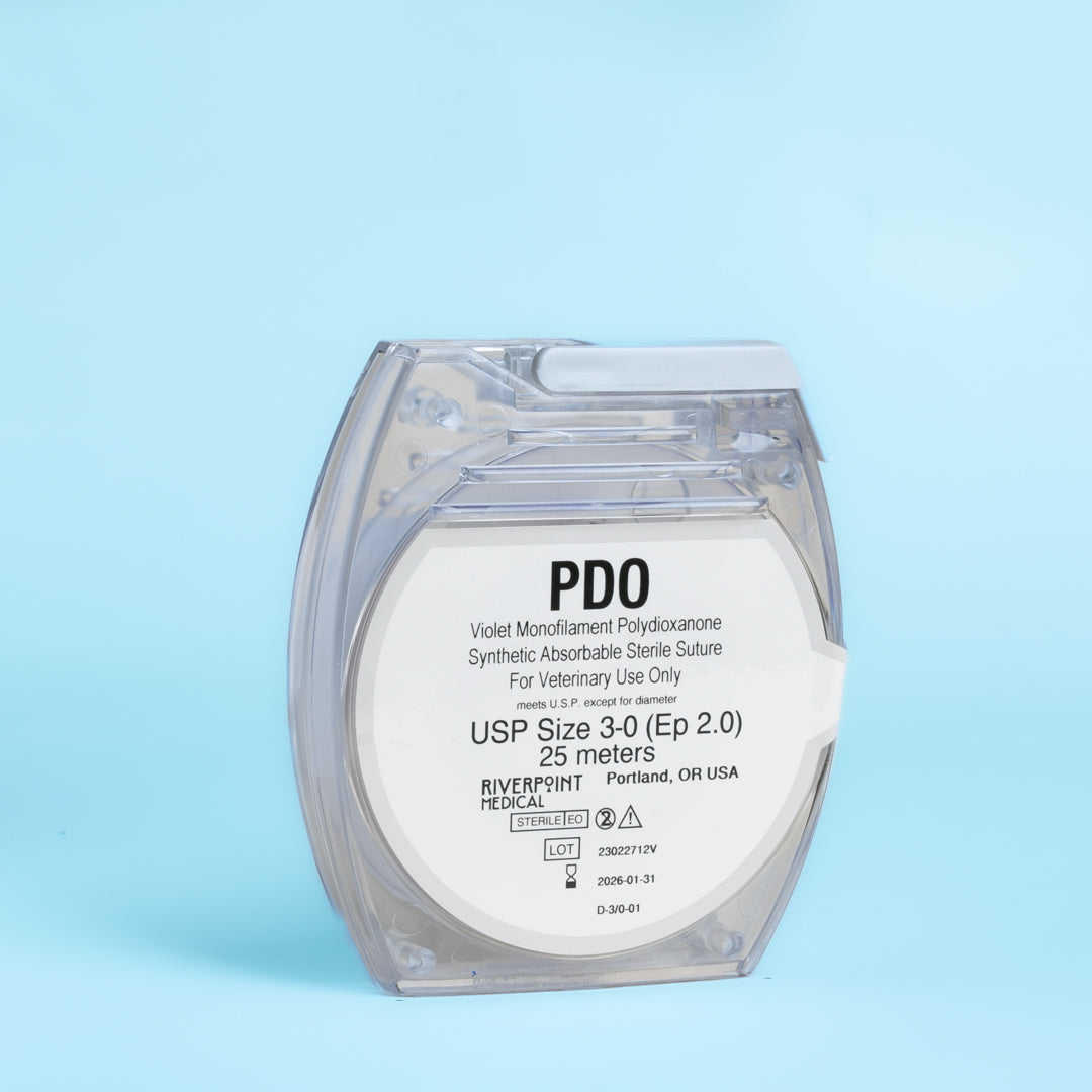 An image of a clear micro cassette containing a 25-meter roll of 3-0 PDO violet monofilament suture, labeled for veterinary use. The suture's specifications, including its size, length, and color, are clearly displayed, along with its absorbable nature and suitability for a range of surgical procedures. This product exemplifies high-quality surgical materials designed for effective and safe veterinary applications.