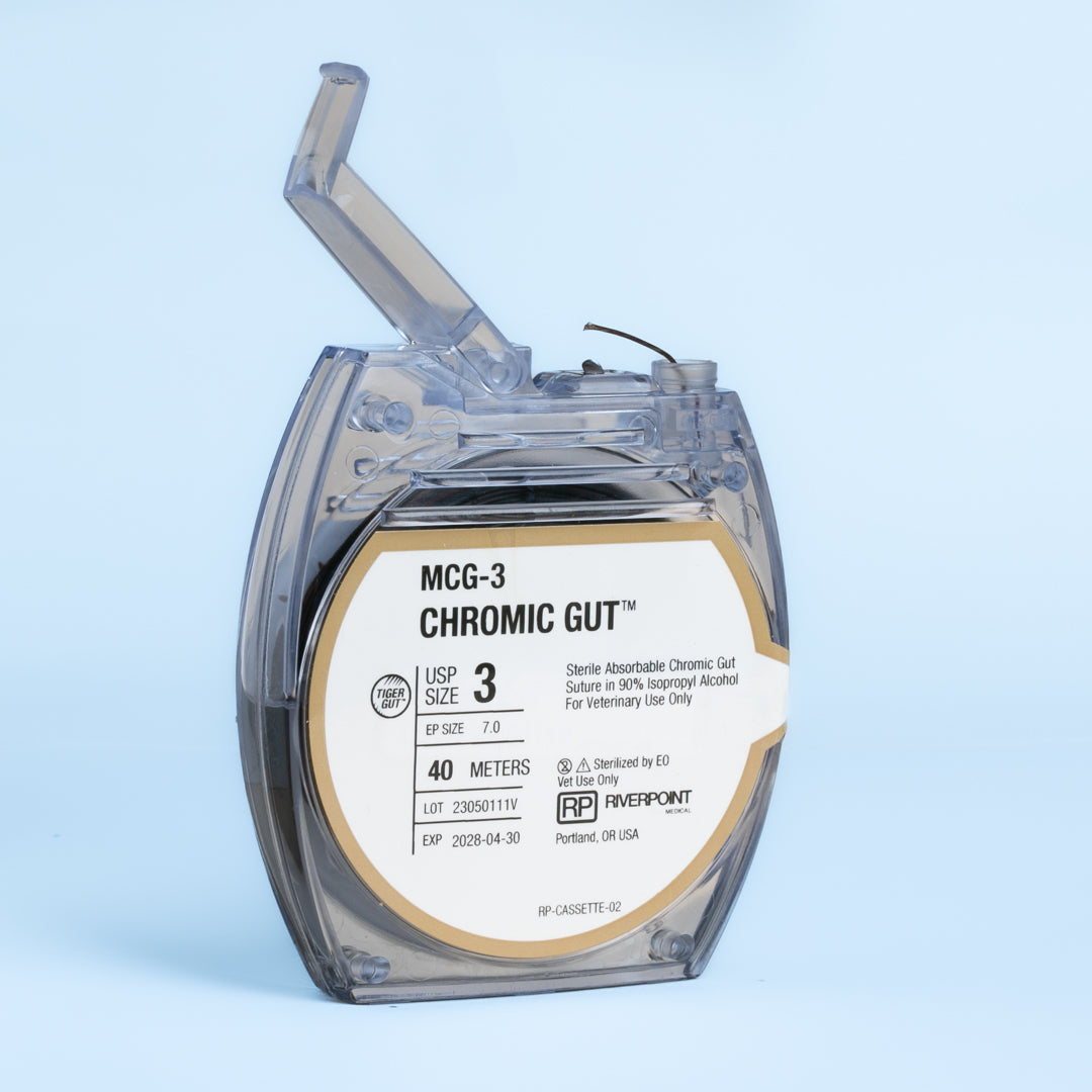 Image of RIVERPOINT MCG-3 Chromic Gut suture cassette, showcasing a 40-meter violet suture coil, size 3 (Ep 7.0), for veterinary surgical use. The label indicates gamma irradiation sterilization, a two-week wound support duration, and ethylene oxide (EO) sterilization method. The product, marked for its high-quality chromic gut material, promises reliable performance and ease of use in a variety of surgical applications.