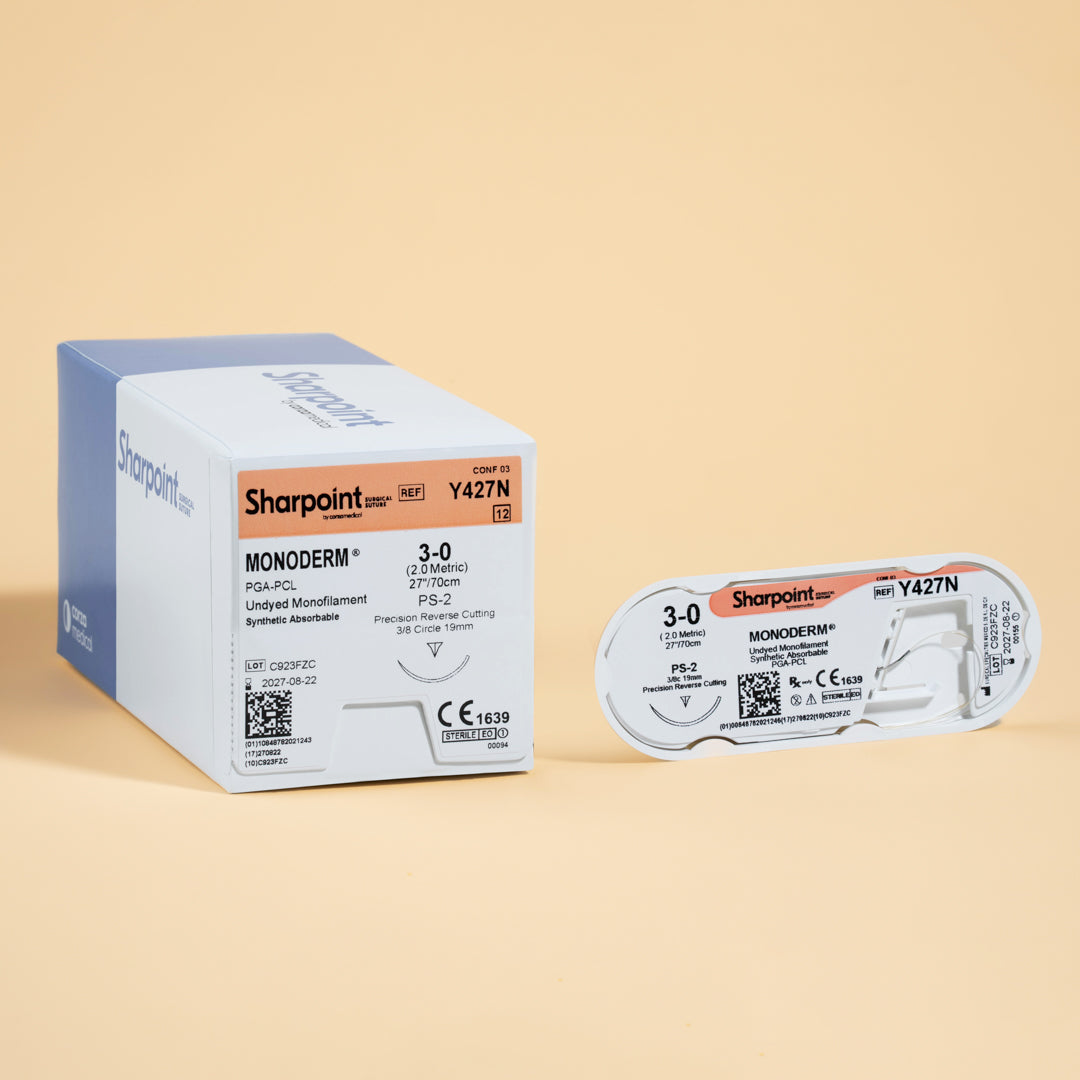 A Sharpoint Monoderm box labeled Y427N, containing 3-0 gauge, 27-inch length PGA-PCL monofilament sutures with a PS-2 precision reverse cutting needle. The packaging highlights the suture's absorbable nature, designed for delicate surgical applications where minimal tissue trauma and secure wound closure are essential. Manufactured by Surgical Specialties for professional use, ensuring sterility and reliability