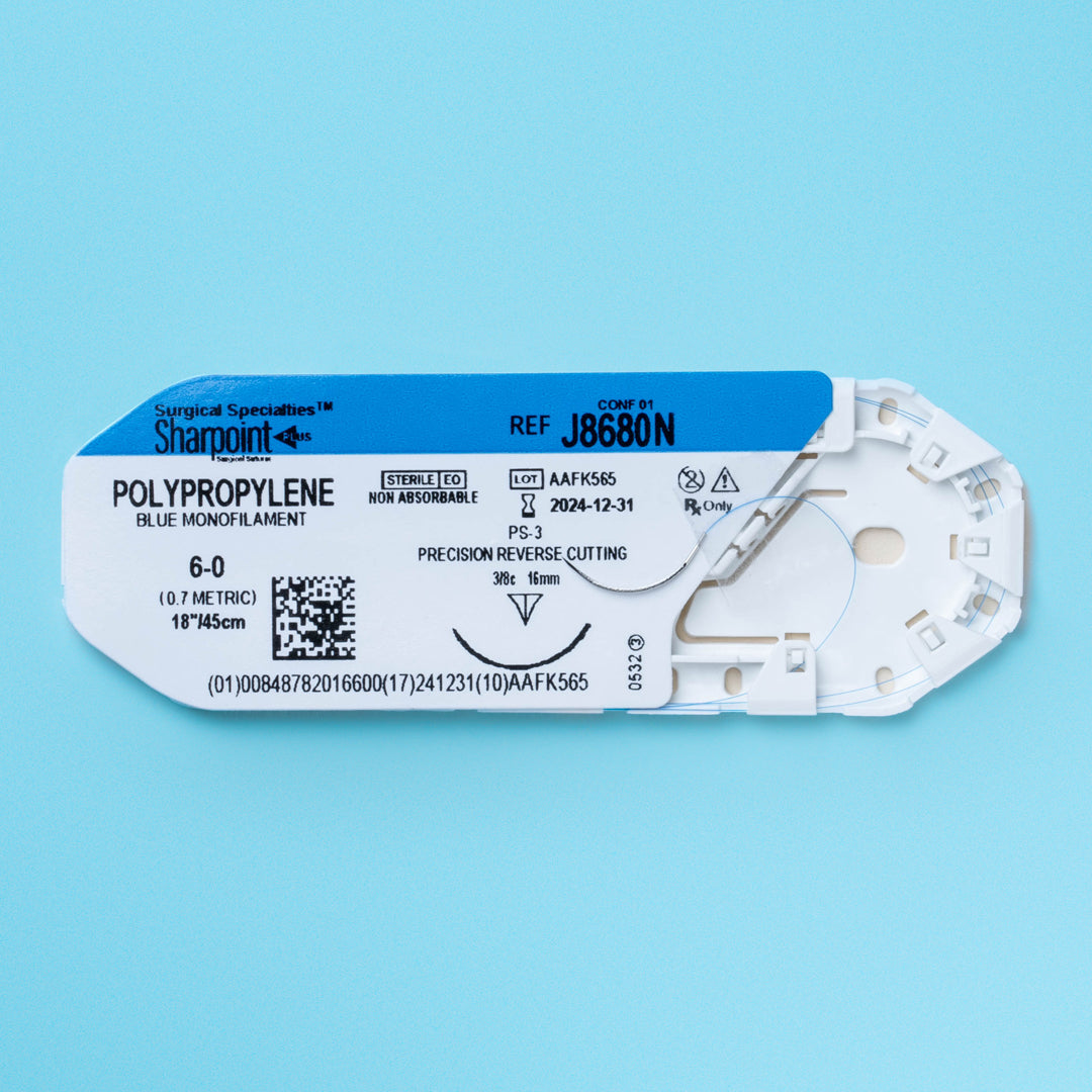 A box and individual pack of Sharpoint 6-0 blue polypropylene suture (J8680N) featuring a 16mm precision reverse cutting needle. This non-absorbable monofilament suture is ideal for specialized surgeries requiring precise tissue approximation and long-term support. The packaging highlights its use for delicate procedures in various medical fields, indicating its sterility and the high-quality manufacturing standards of Surgical Specialties