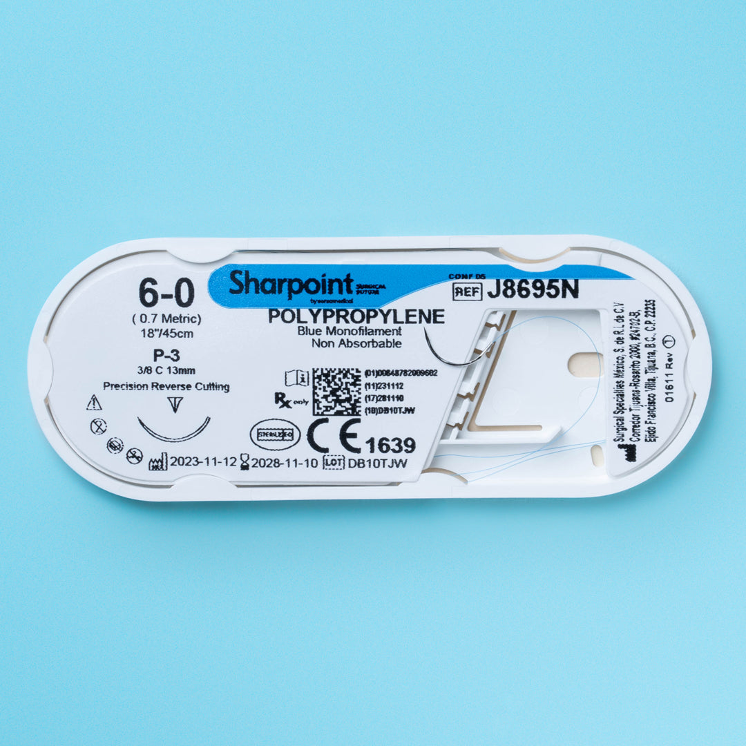 A box and suture packet of Sharpoint 6-0 blue polypropylene suture (J8695N), featuring a P-3 precision reverse cutting needle for exact suturing. This non-absorbable monofilament suture is designed for high-precision surgical procedures, offering lasting support and minimal tissue reaction. It's showcased as a key tool for professionals in specialized surgeries, emphasizing its quality and reliability